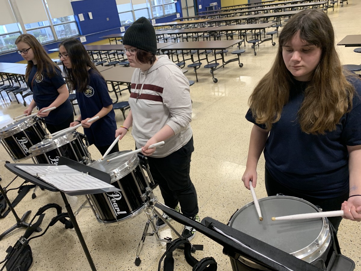 Students practicing with their drums.
