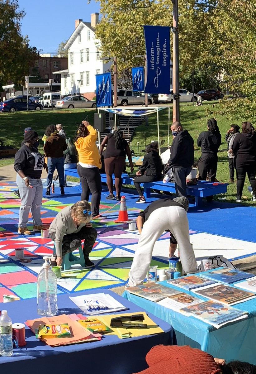 Photo of volunteers painting the Freedom Quilt.