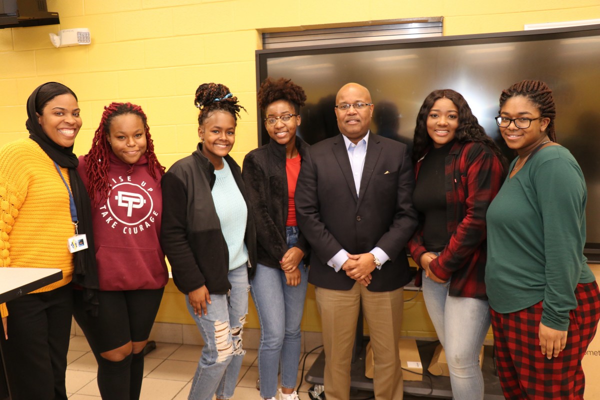 NFA Black History Club Executive Board poses for a photo with Mr. Philip Howard and Ms. Khadijah Powell.