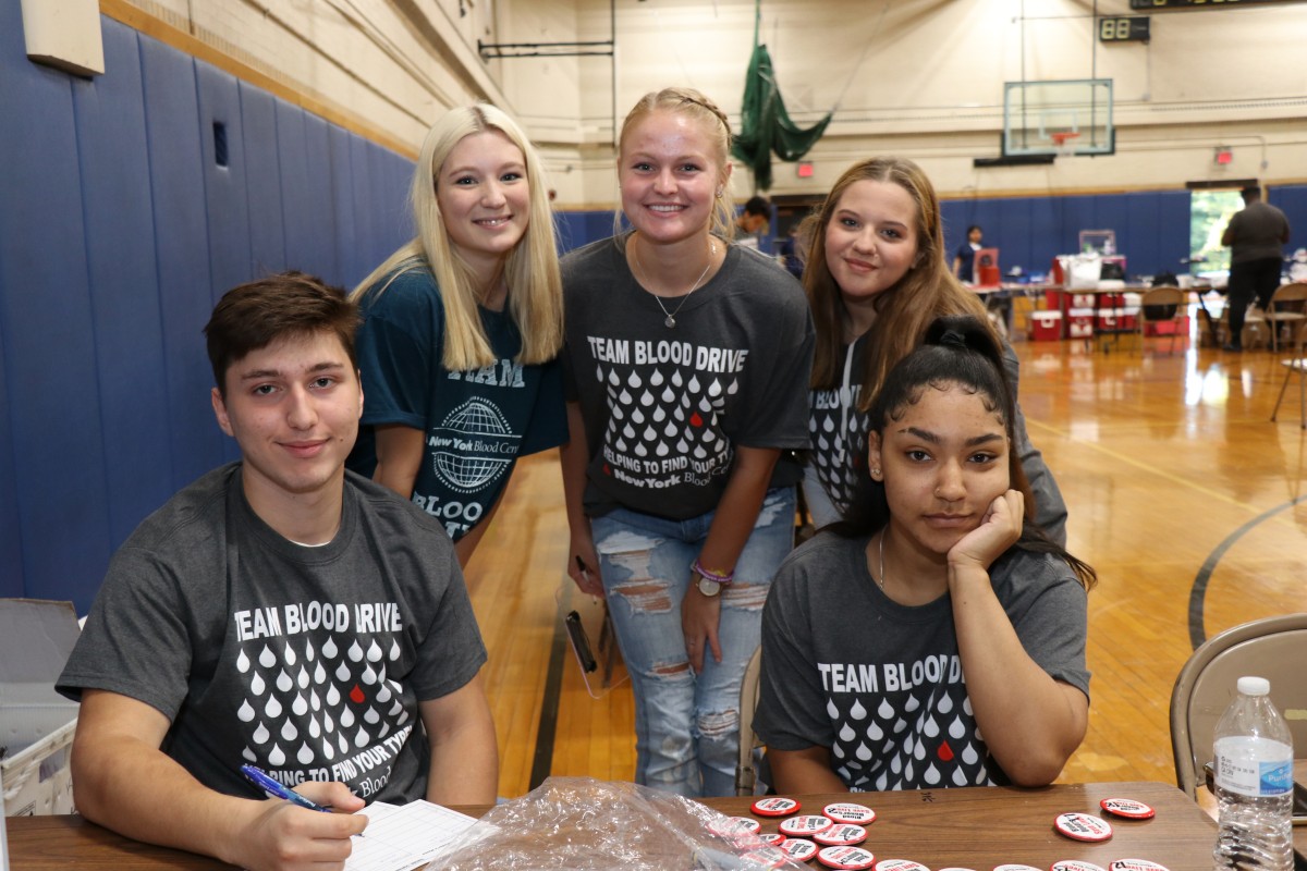 Volunteers pose for a photo.