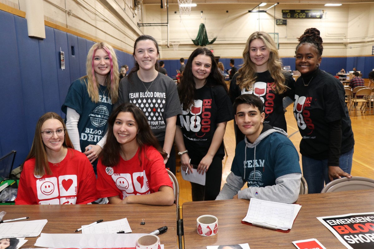 Student volunteers pose for a photo.