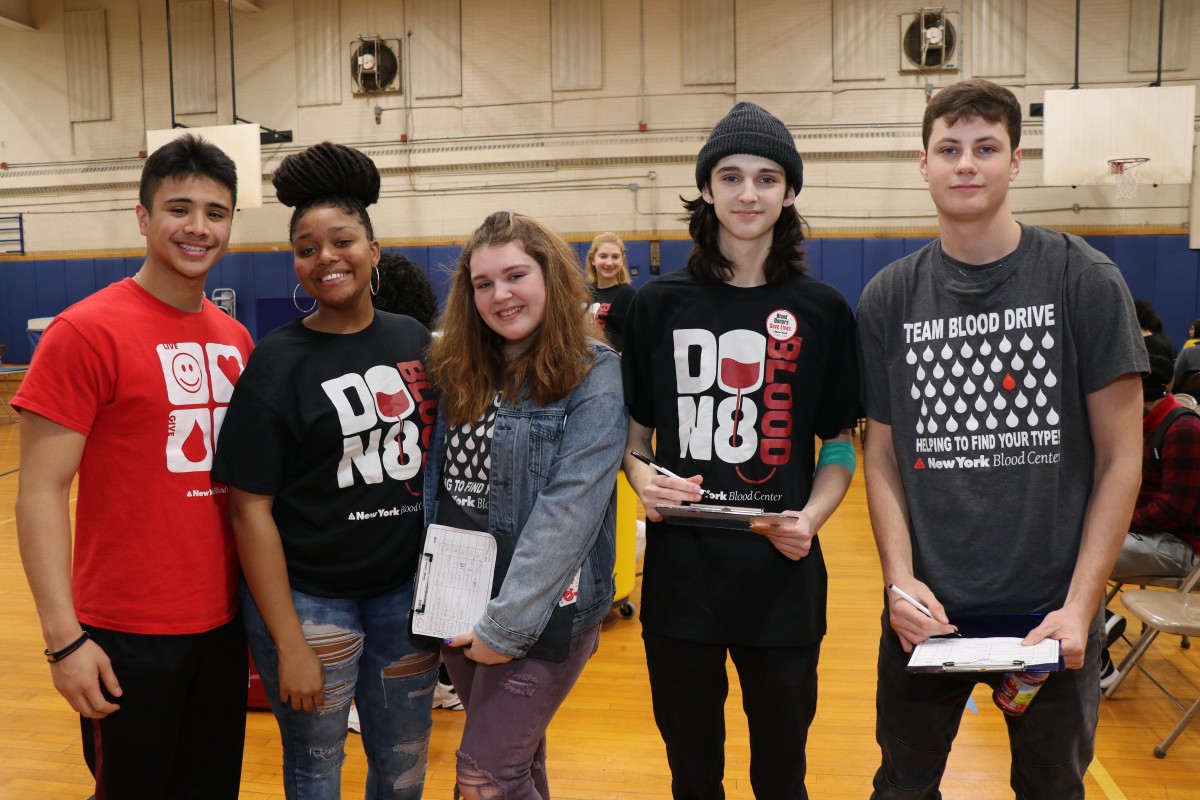 Student volunteers pose for a photo.