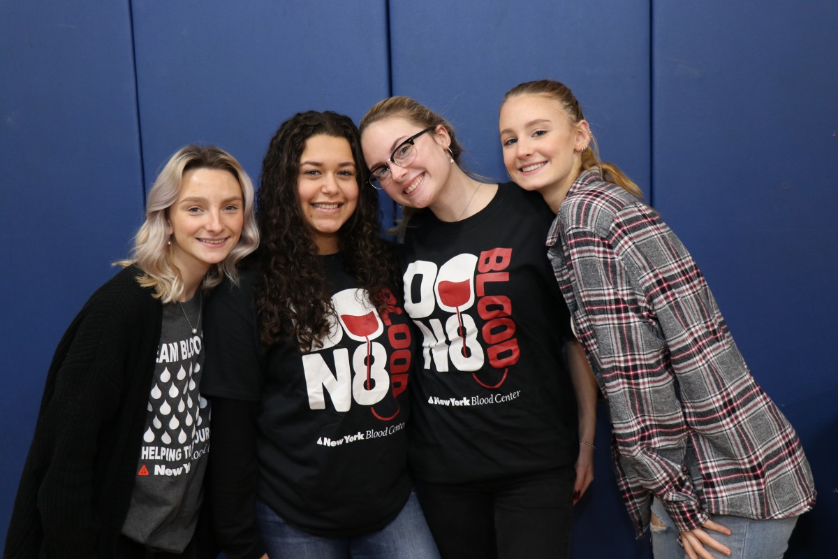 Student volunteers pose for a photo.