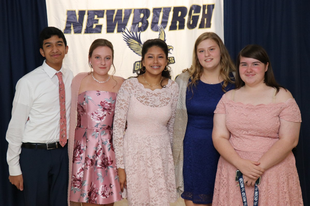 Students pose for a photo as they enter the dance.