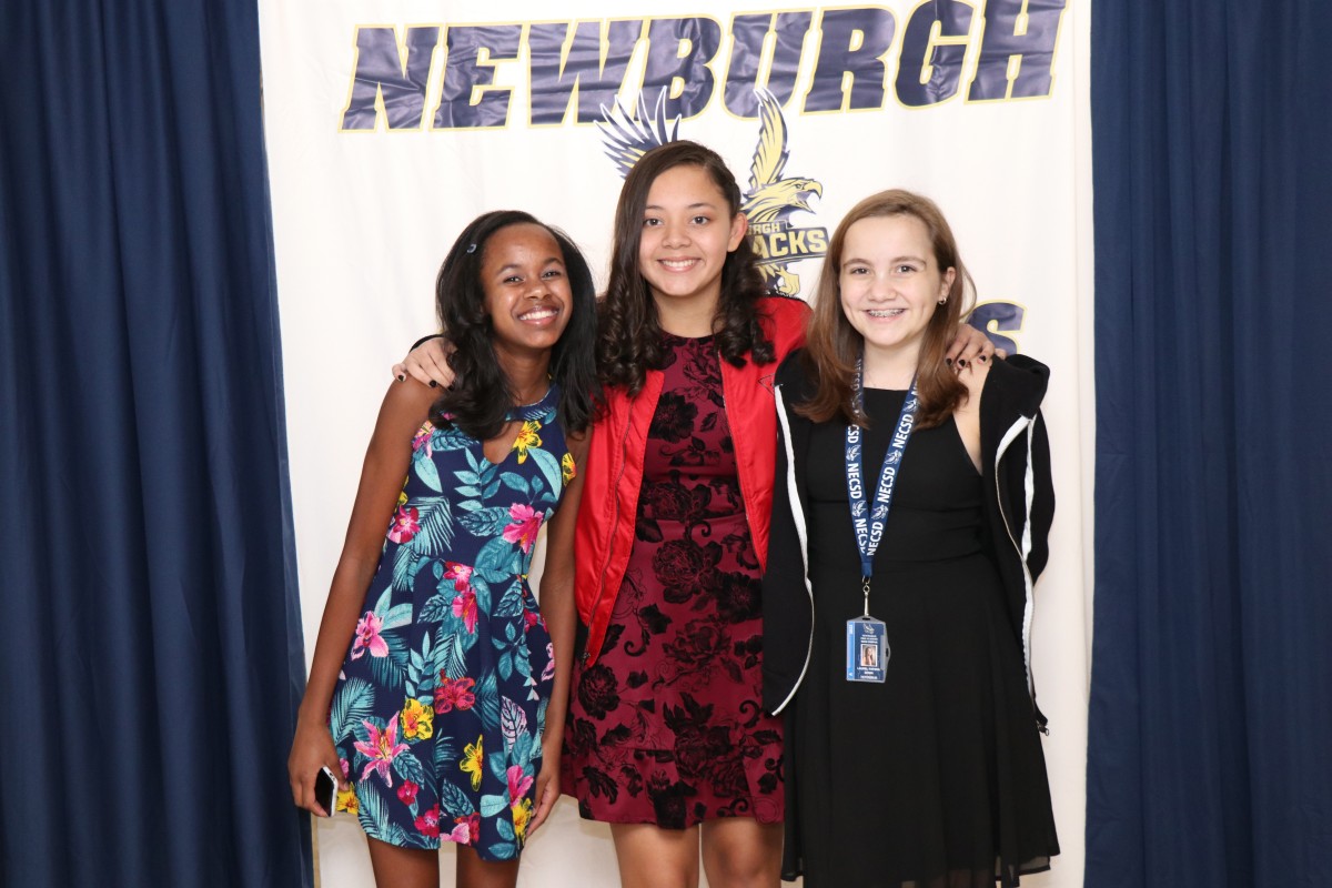 Students pose for a photo as they enter the dance.