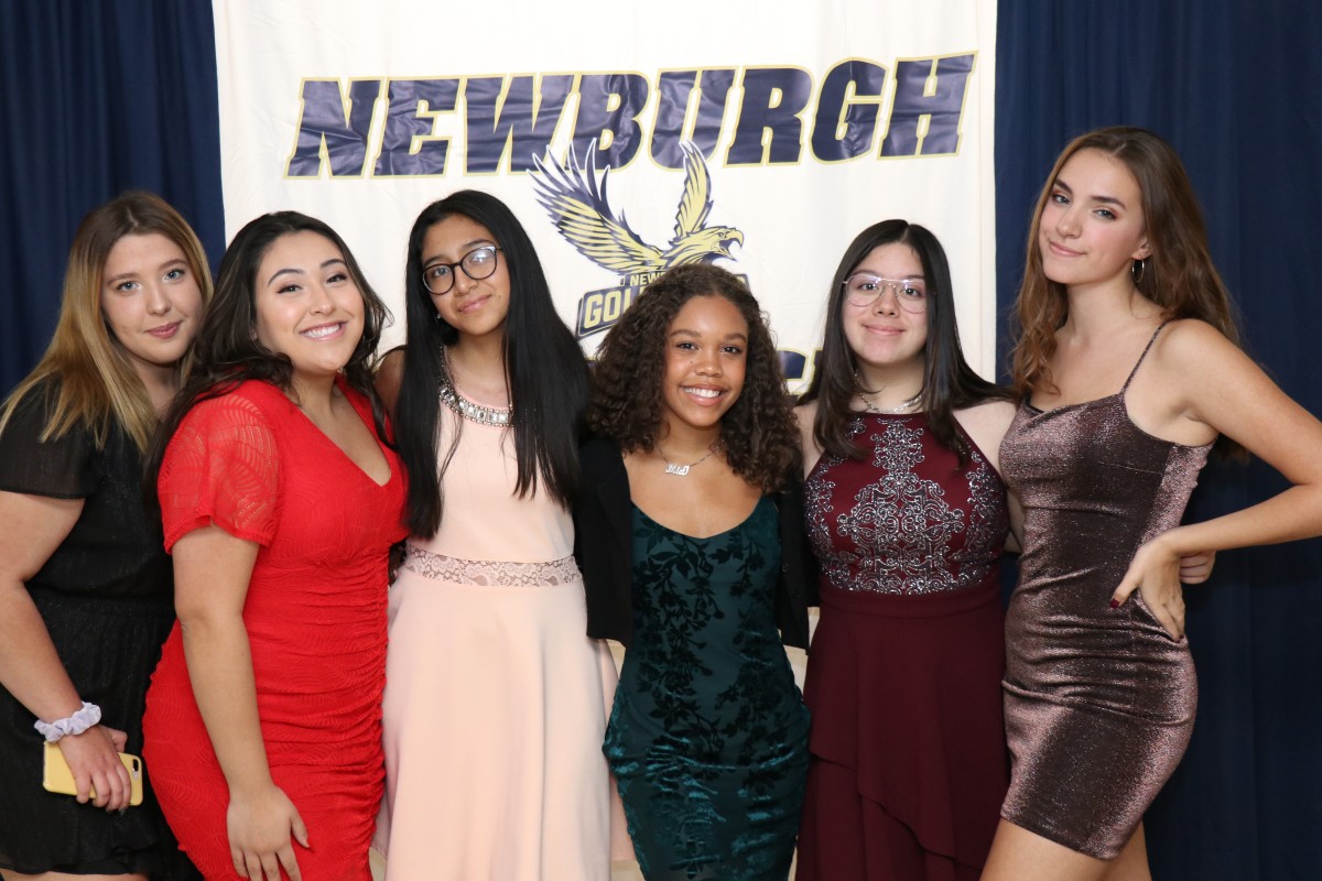 Students pose for a photo as they enter the dance.