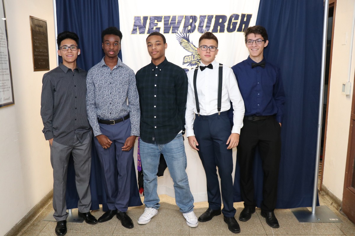 Students pose for a photo as they enter the dance.