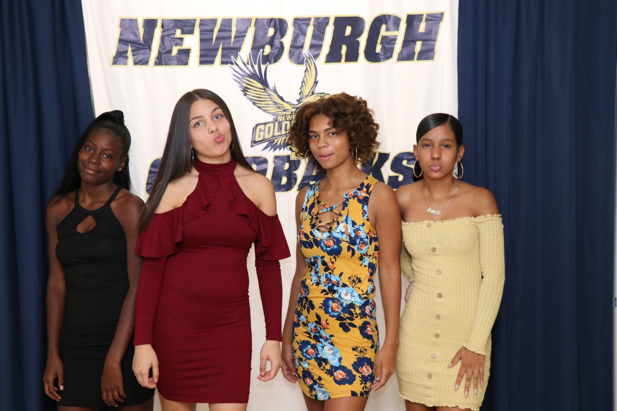 Students pose for a photo as they enter the dance.