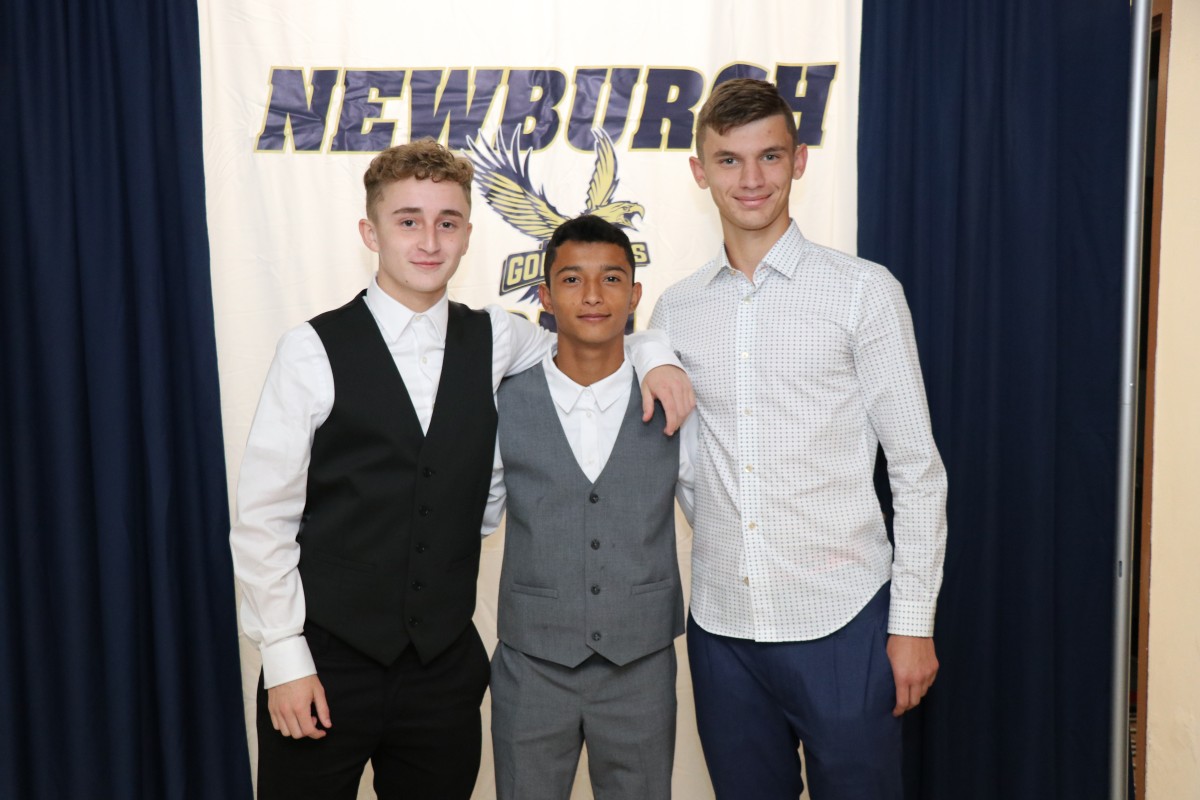 Students pose for a photo as they enter the dance.