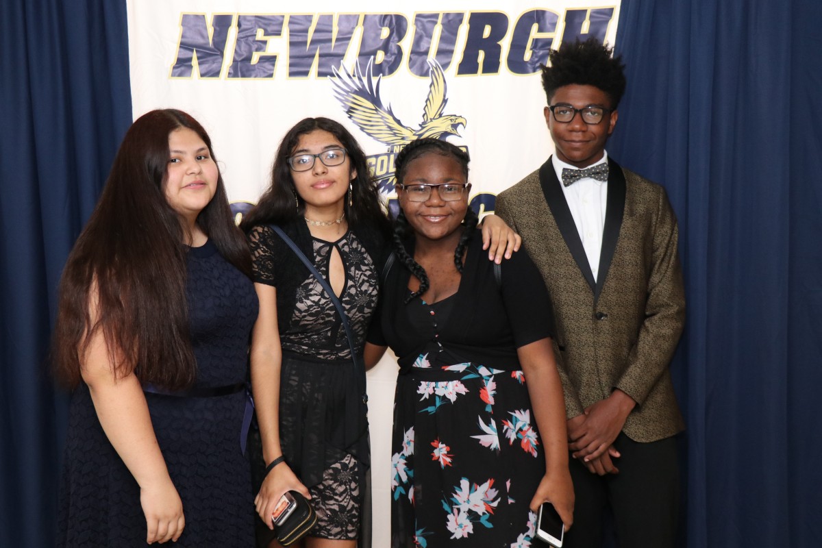 Students pose for a photo as they enter the dance.