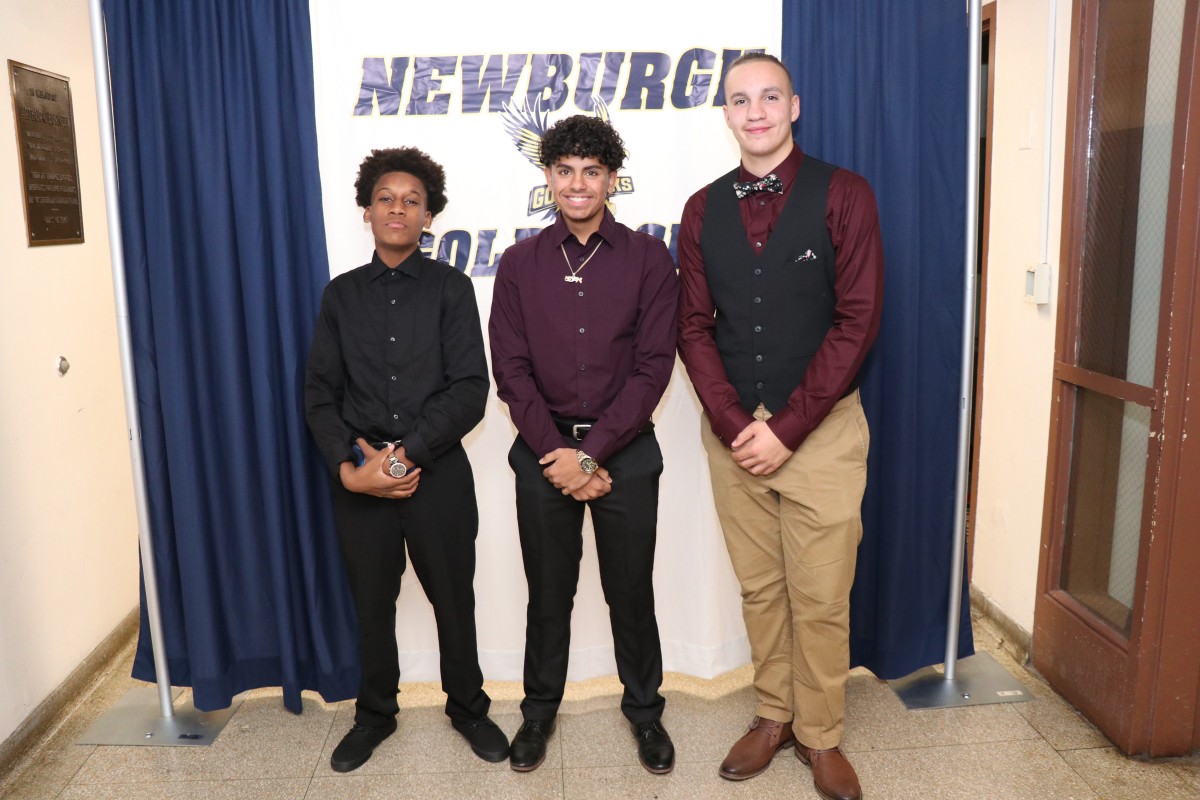 Students pose for a photo as they enter the dance.