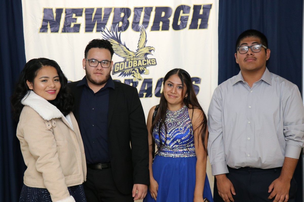 Students pose for a photo as they enter the dance.