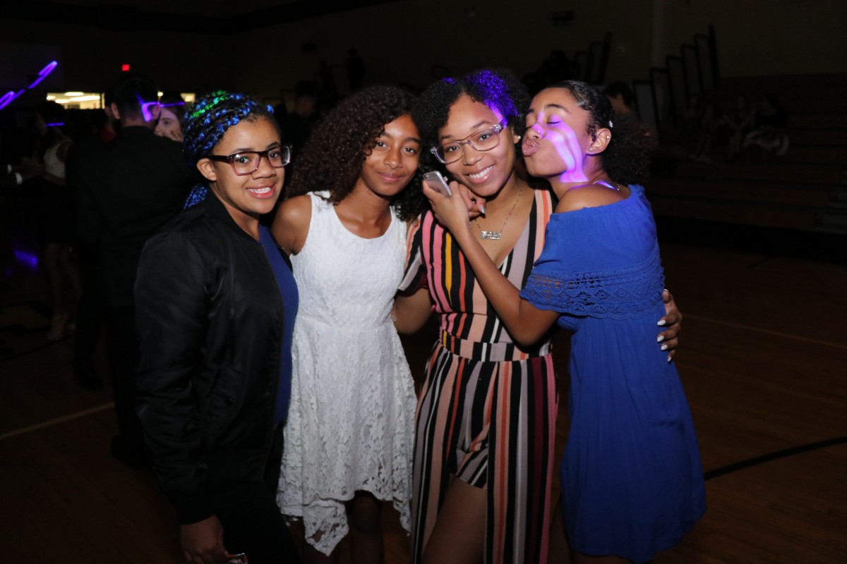 Students pose for photos at the dance.