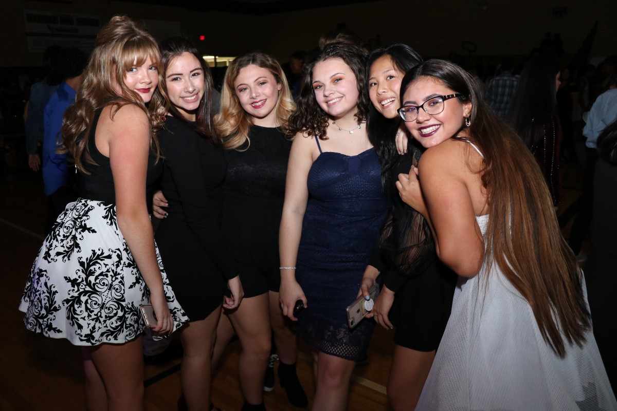 Students pose for photos at the dance.