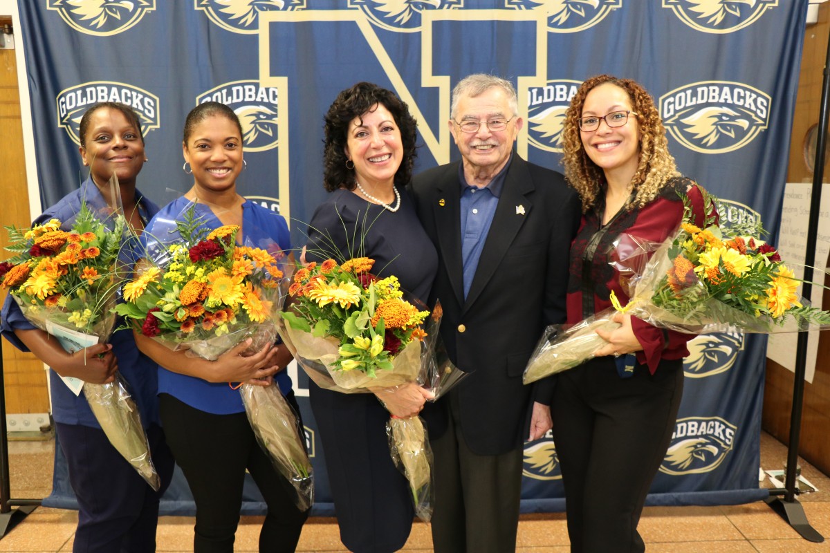 CNA teachers pose for a photo with Mr. Bill Kaplan, founder of the Newburgh Armory Unity Center.