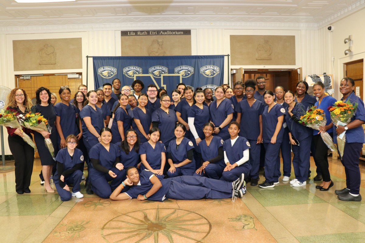 CNA scholars pose for a photo with their teachers.