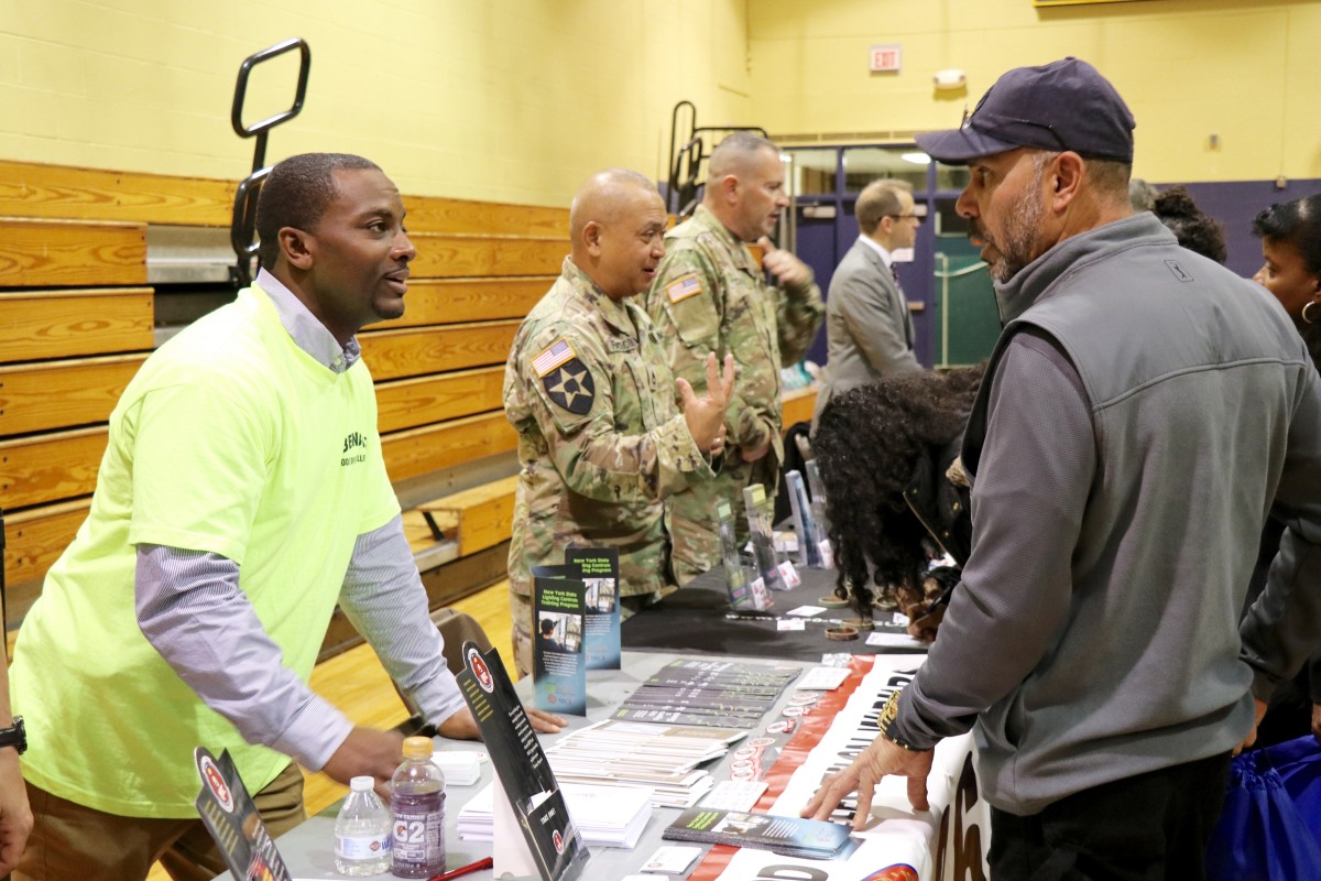 Students and parents speak with recruitment representative