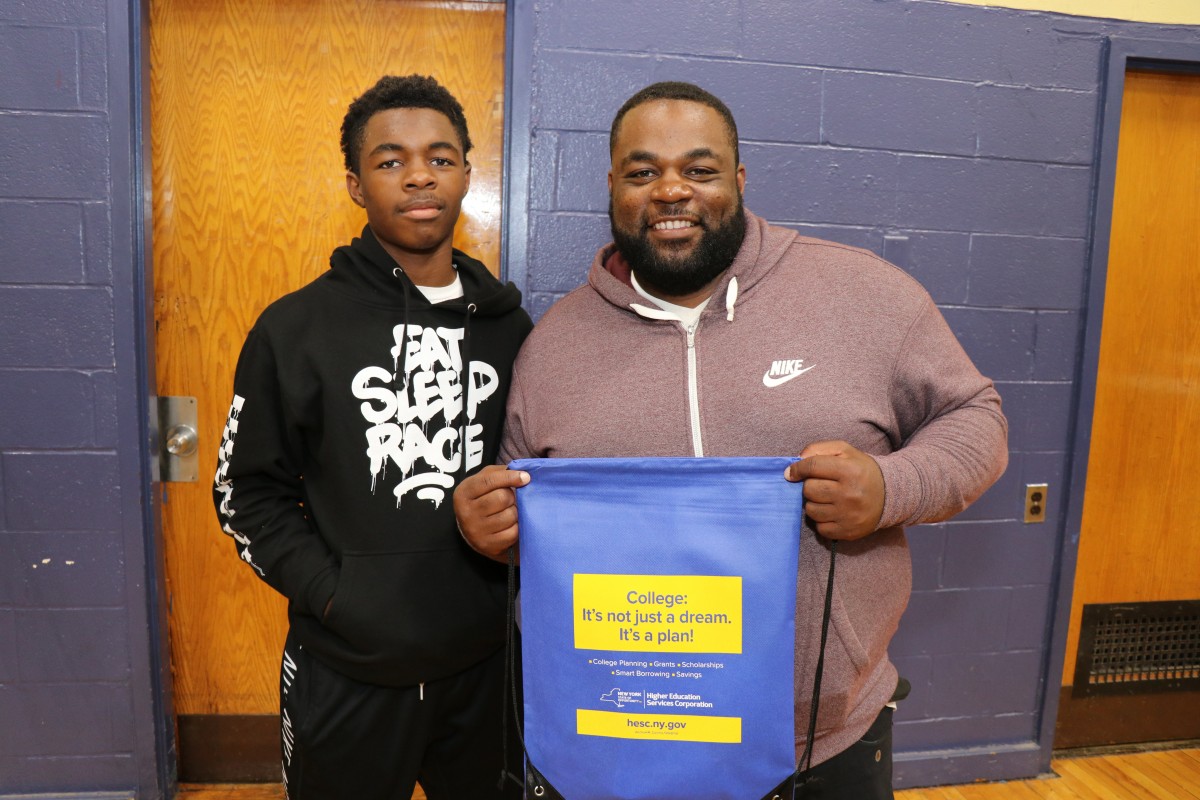 Student poses with his father.