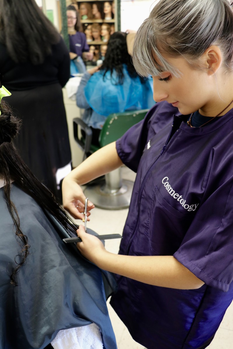 Student cuts hair