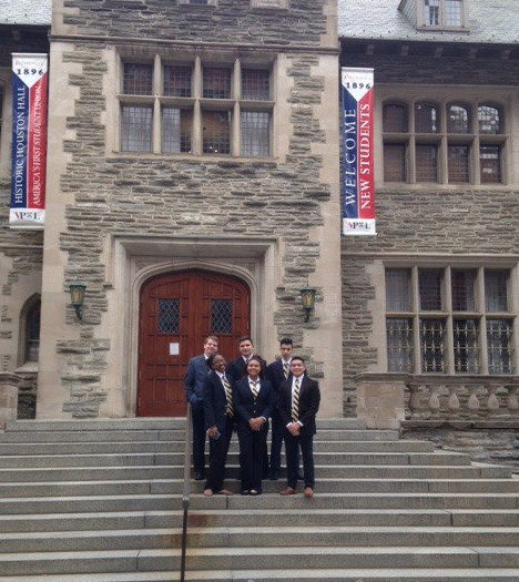 Students on steps in uniform before they compete