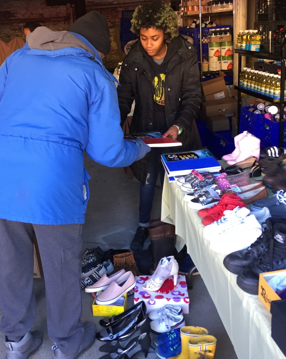 Ms. McLymore distributing items at one of her events