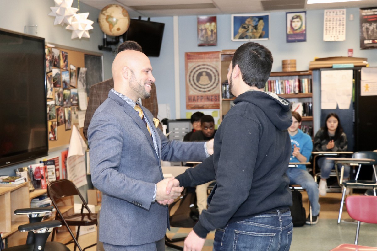 Iggy shaking hands with Dr. Padilla