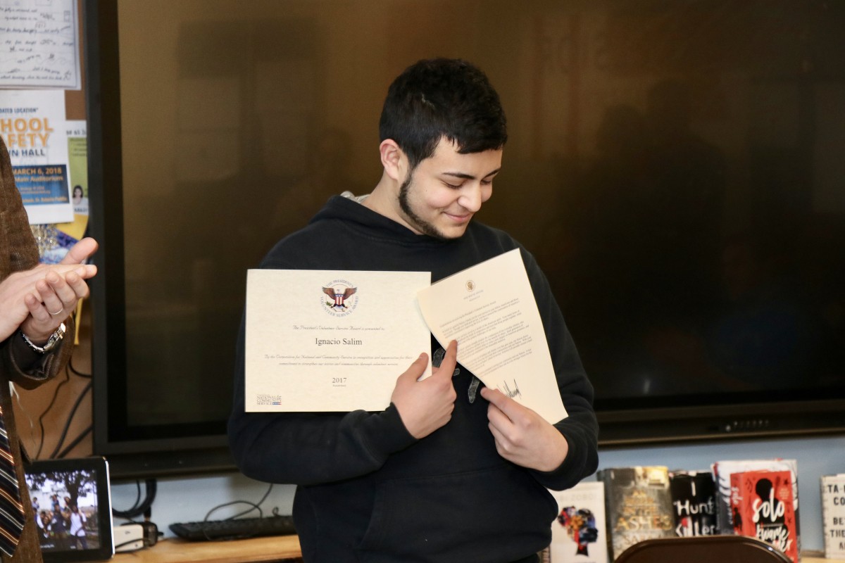 Iggy showing off his letter and certificate