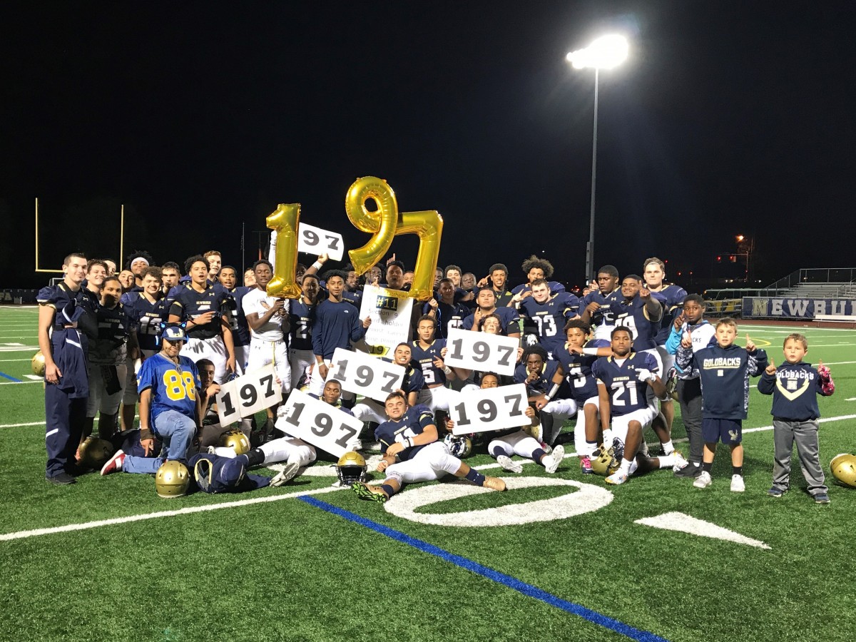 Pete Matthews poses with team and fans after breaking a career kicking record