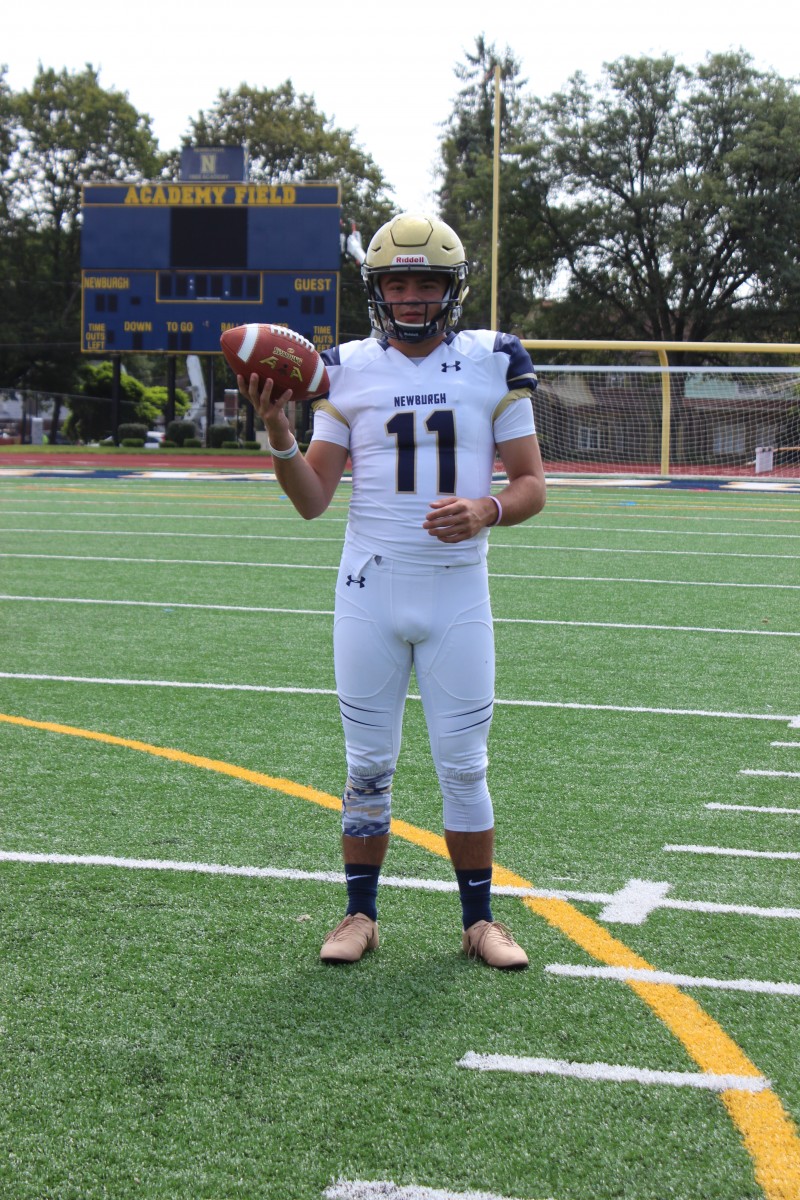 Pete Matthews poses with football. Photo courtesy of: Mrs. Zoe Matthews