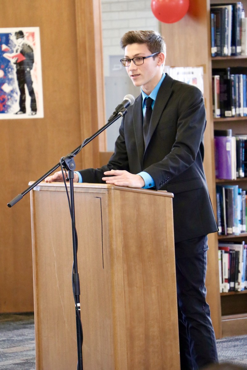 Logan, a junior gives his speech and campaigns during mock election