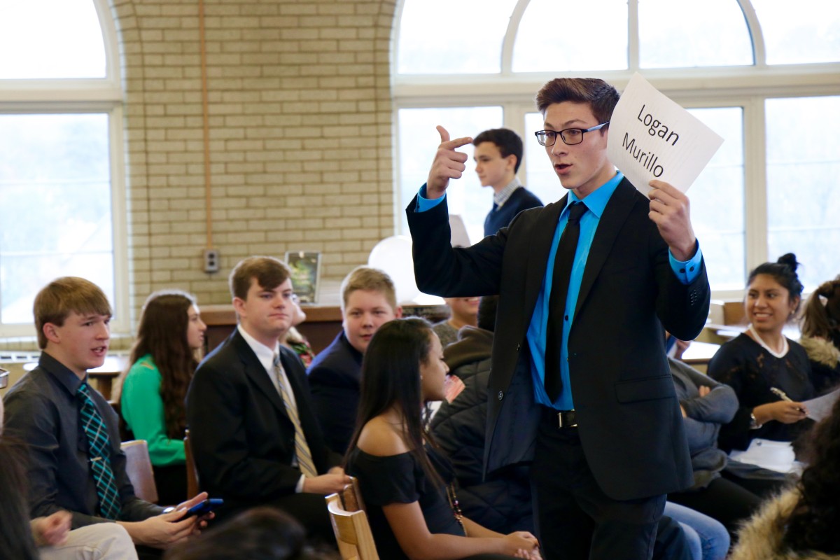 Logan, a junior gives his speech and campaigns during mock election