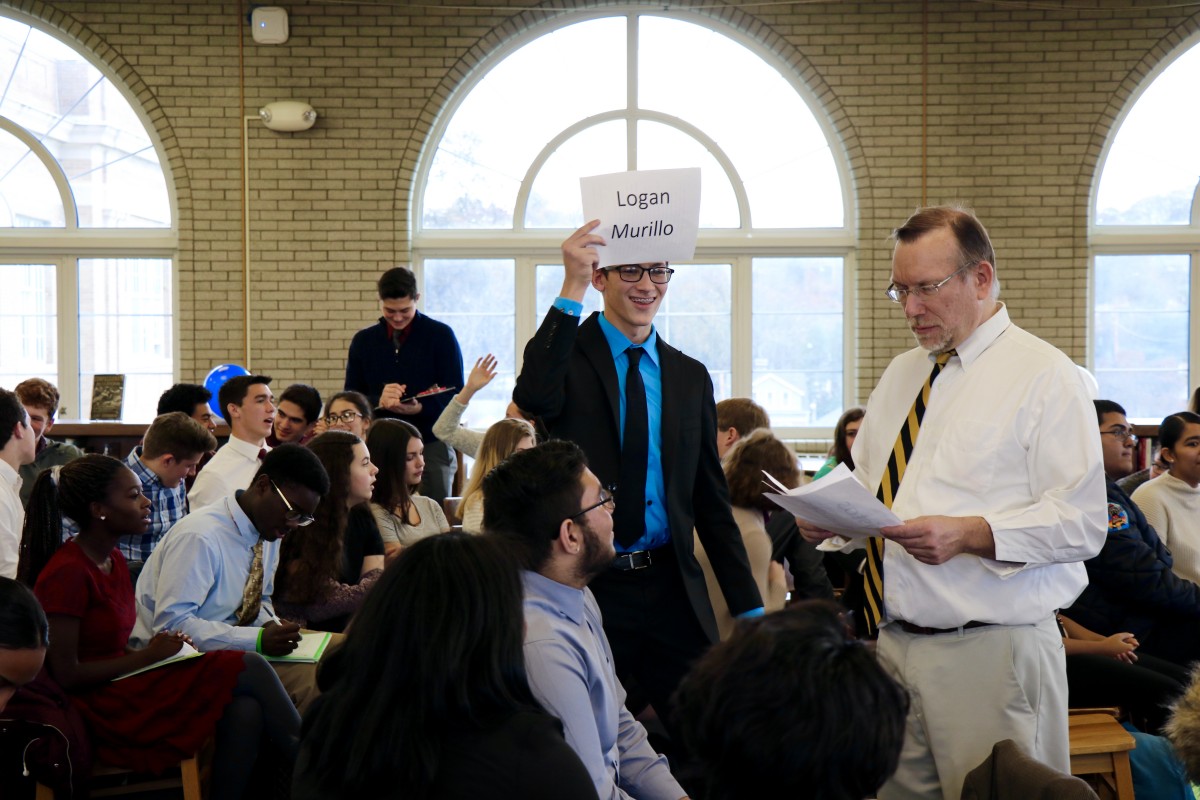 Logan, a junior gives his speech and campaigns during mock election