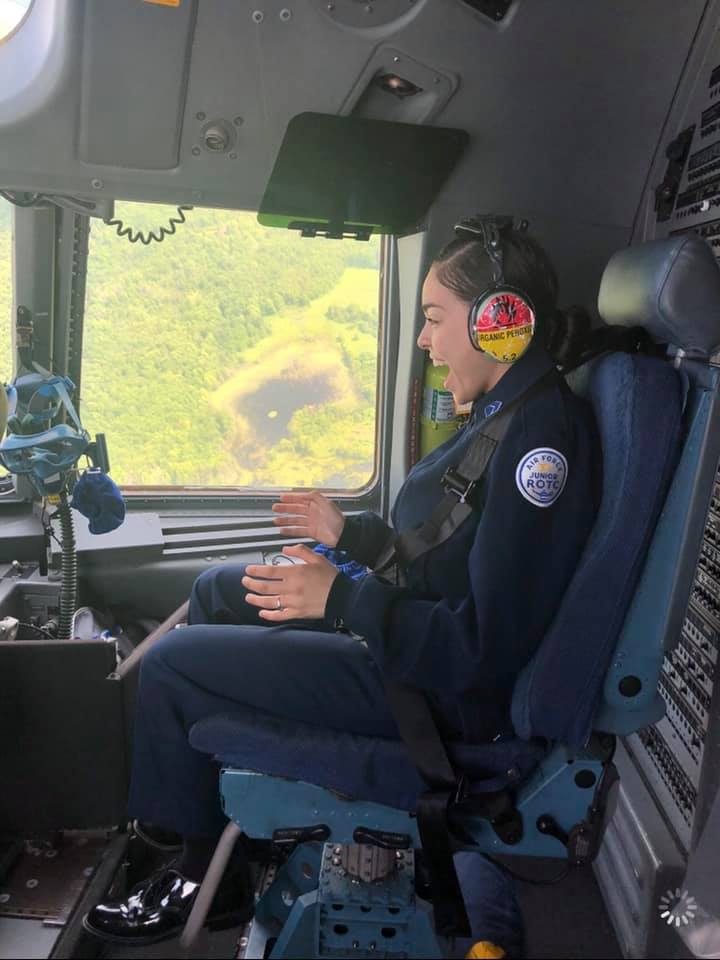 Student sitting in cockpit.