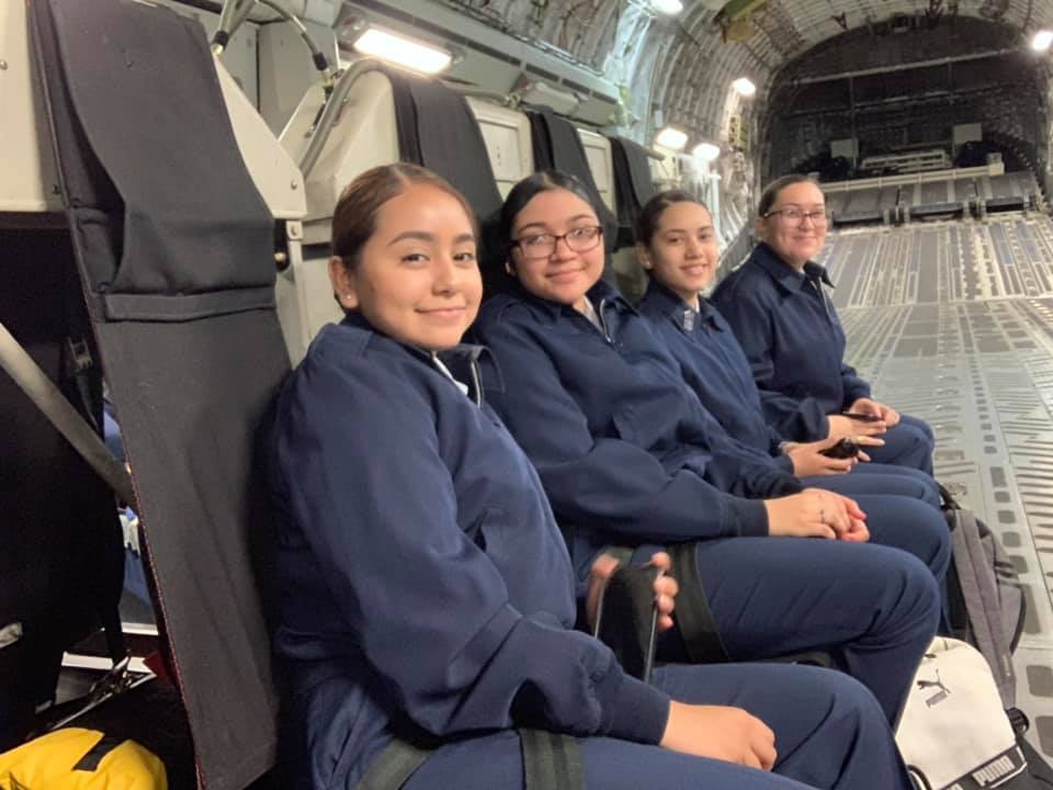 Students sit together on flight.