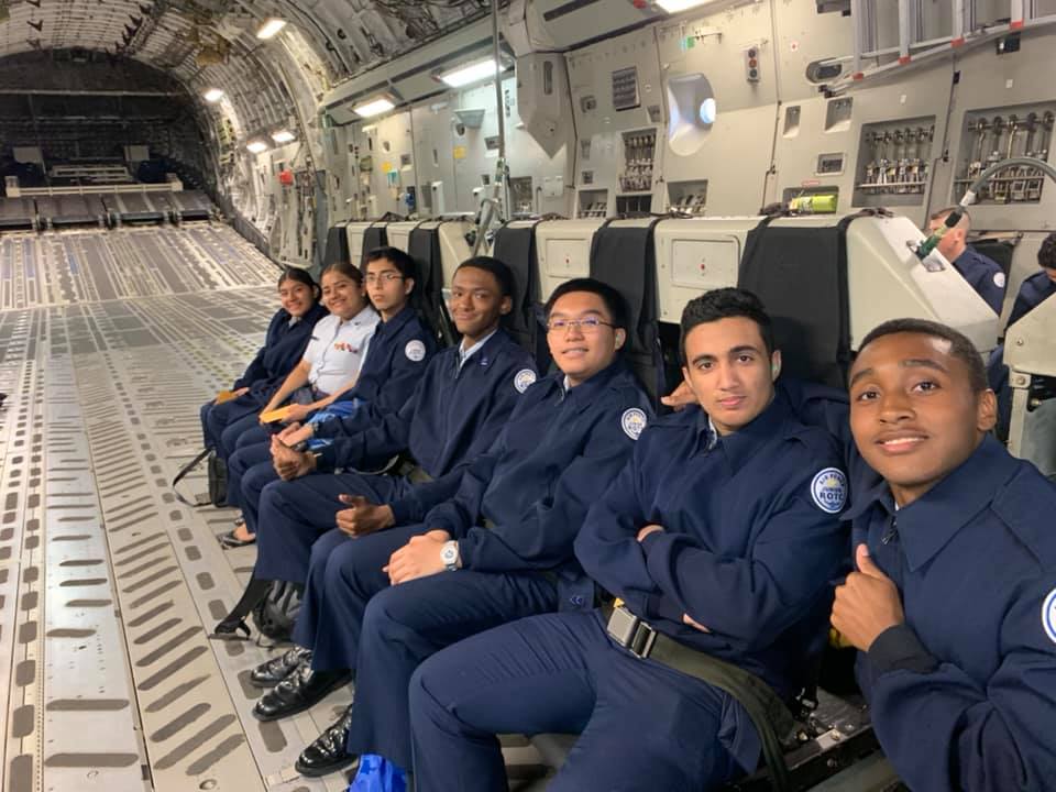 Students sit together on flight.