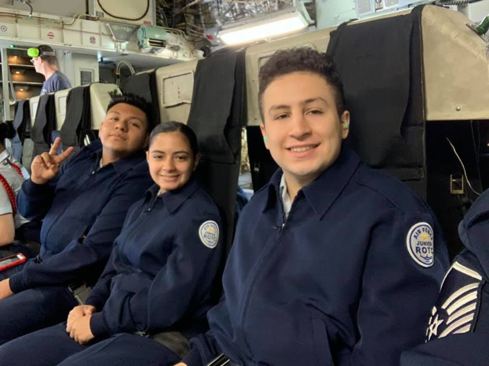 Students sit together on flight.