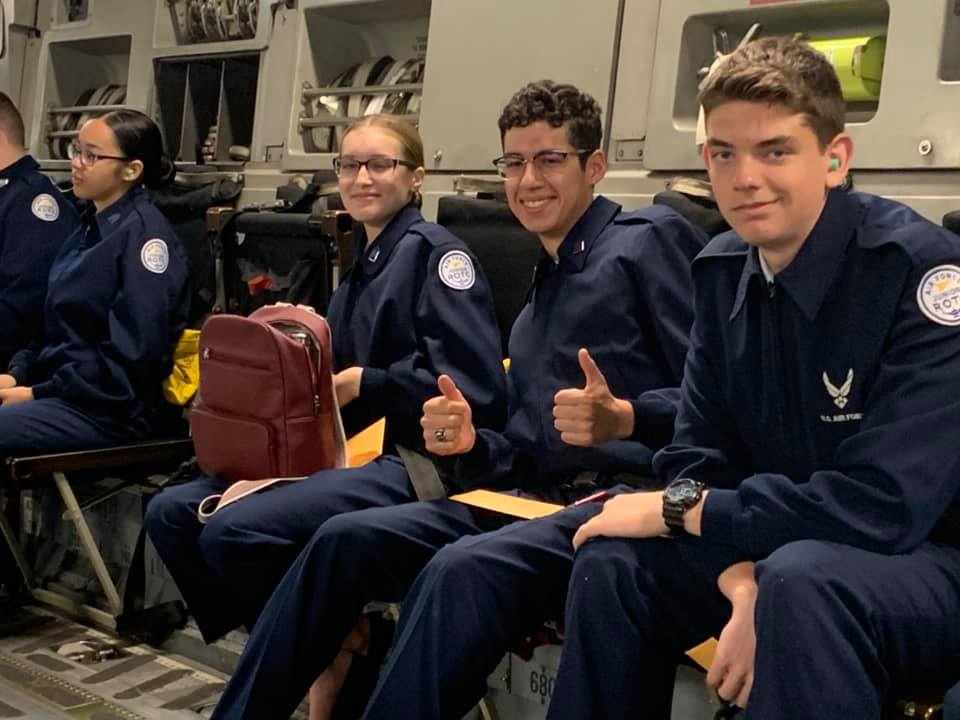 Students sit together on flight.