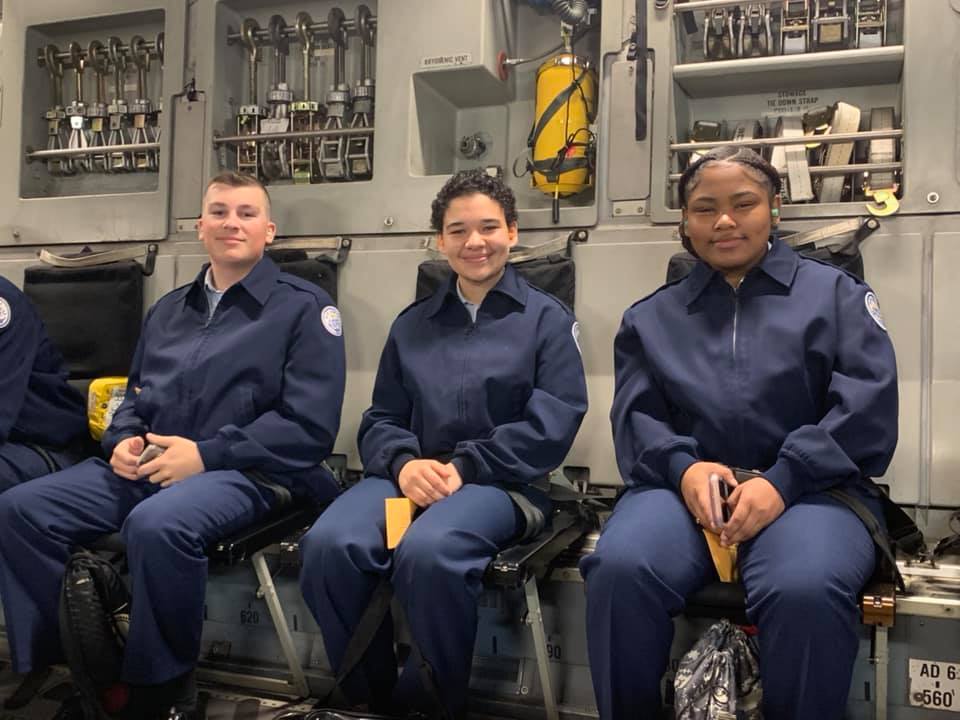 Students sit together on flight.