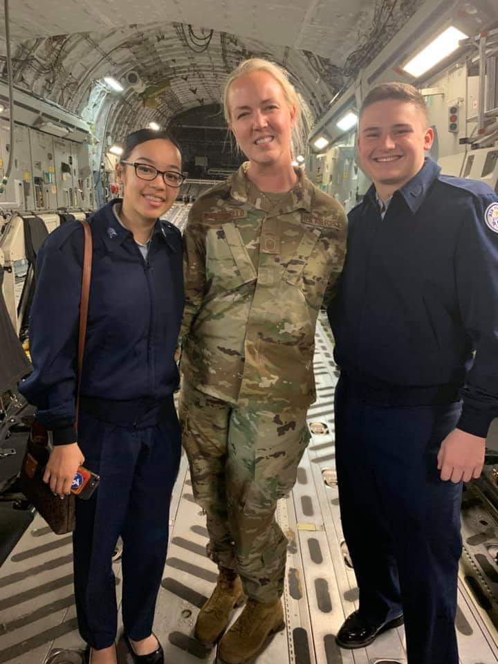 Students stand for photo with MSgt Sara Ruggiero Pastorello.