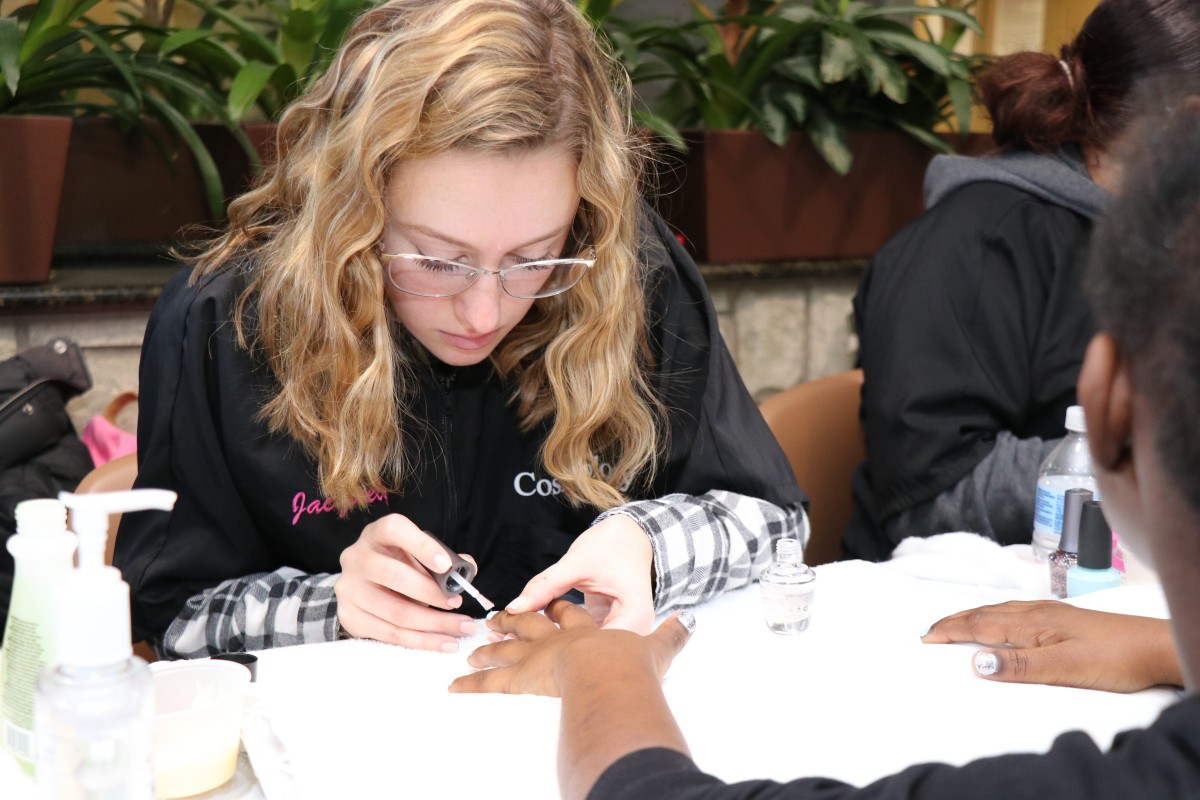 Student painting nails.