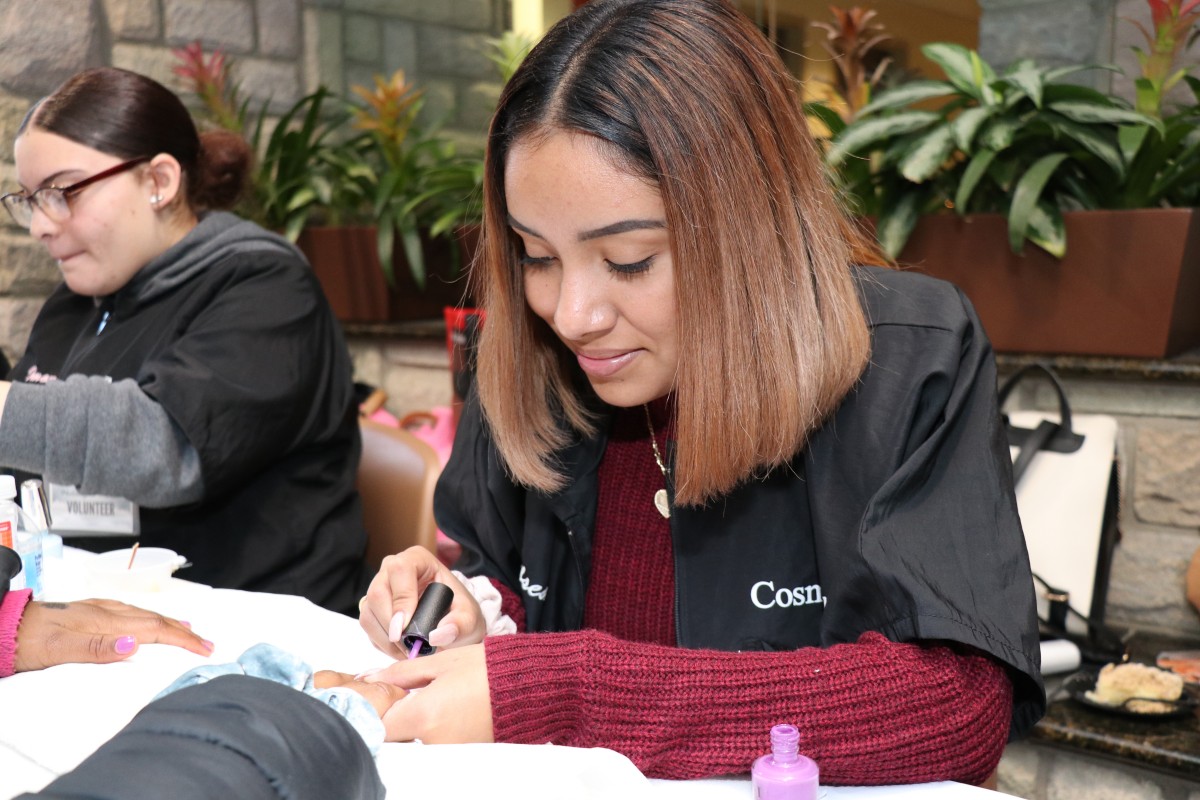 Student painting nails.