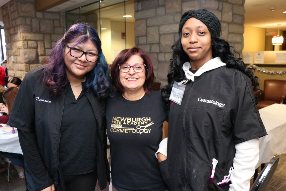 Students and teacher pose for a photo.