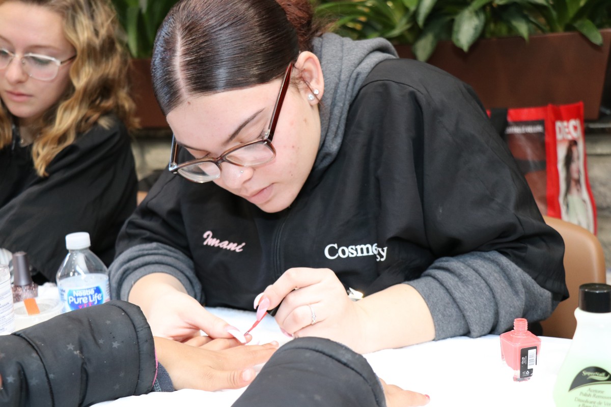 Student painting nails.