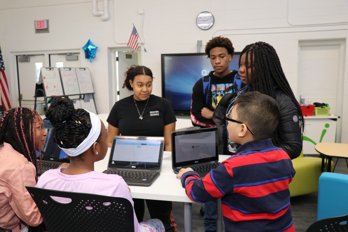 High school scholars teaching elementary scholars.