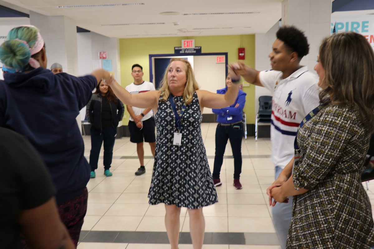 House principal, Ms. Sandy Wood engages students in an activity.