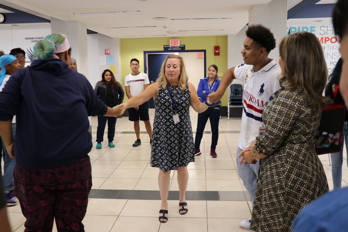 House principal, Ms. Sandy Wood engages students in an activity.