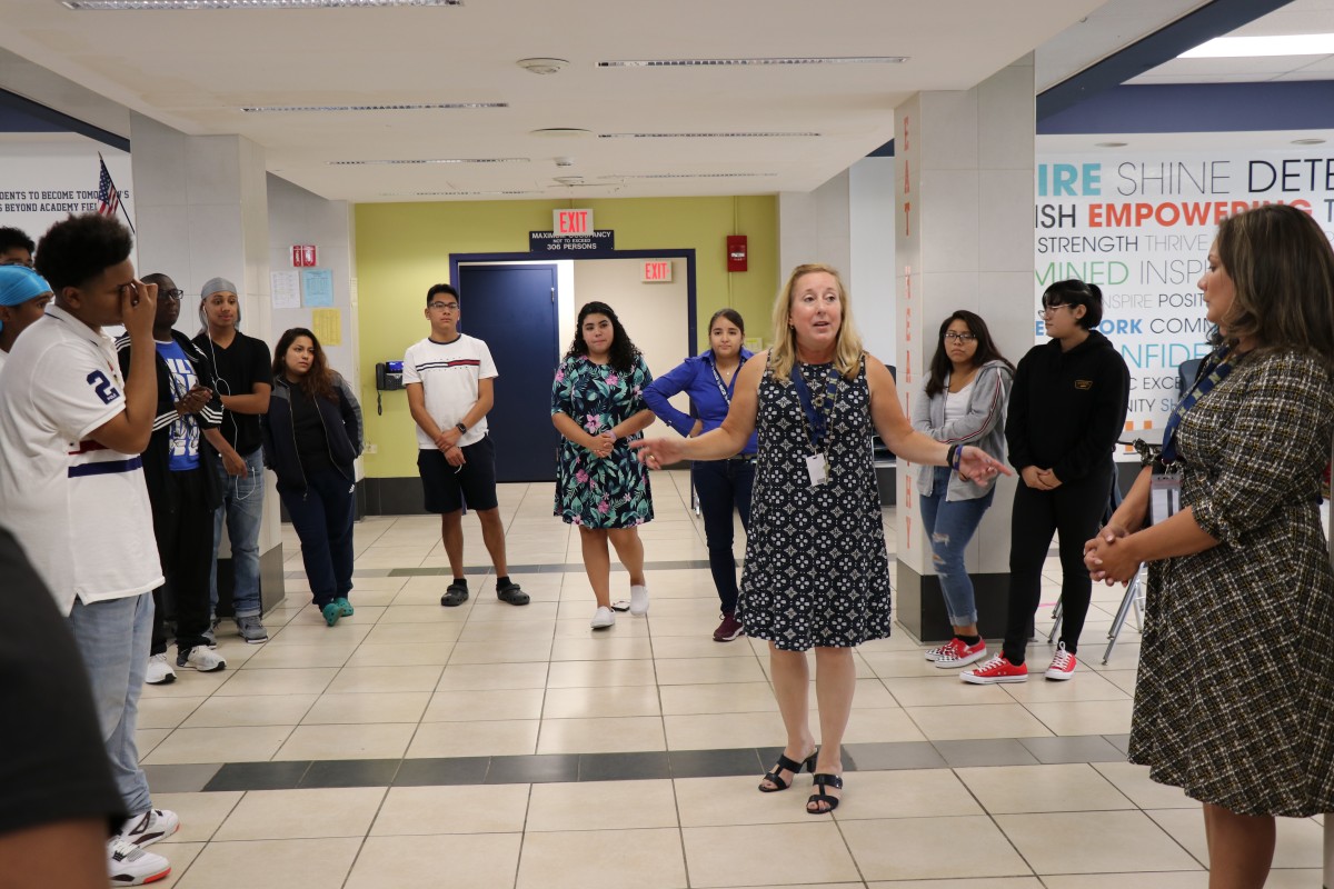 House principal, Ms. Sandy Wood engages students in an activity.
