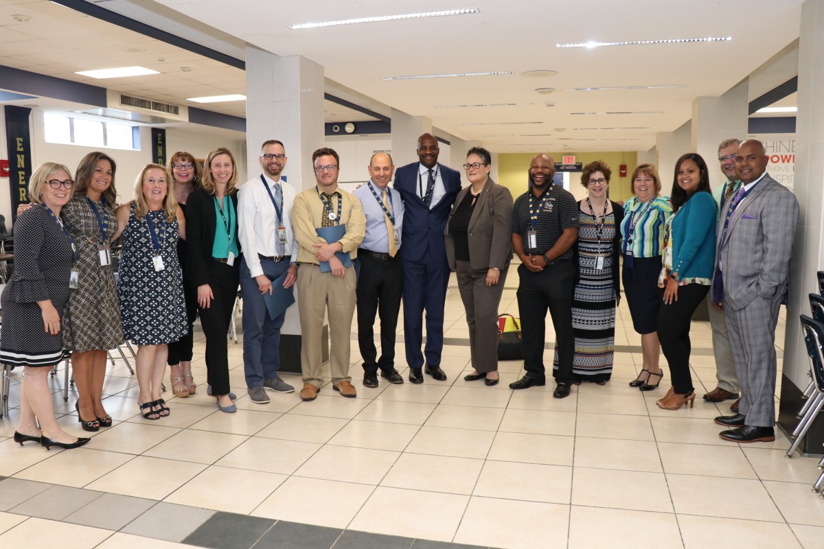 Central administration pose for a photo during the launch of the NFA Evening School program.