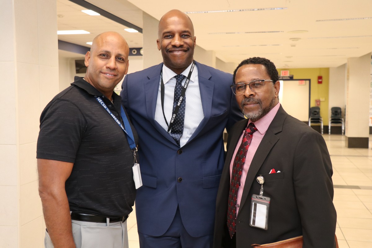 Security Supervisor Adam Mejias, Mr. Danny Dottin, Executive Director for Human Resources, and Mr. Michael McLymore Assistant Superintendent for Human Resources pose for a photo.
