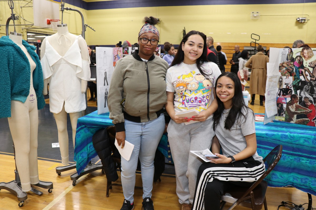 Students and teachers pose for a photo.